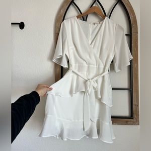 White mini flowing dress with layering and tie waist